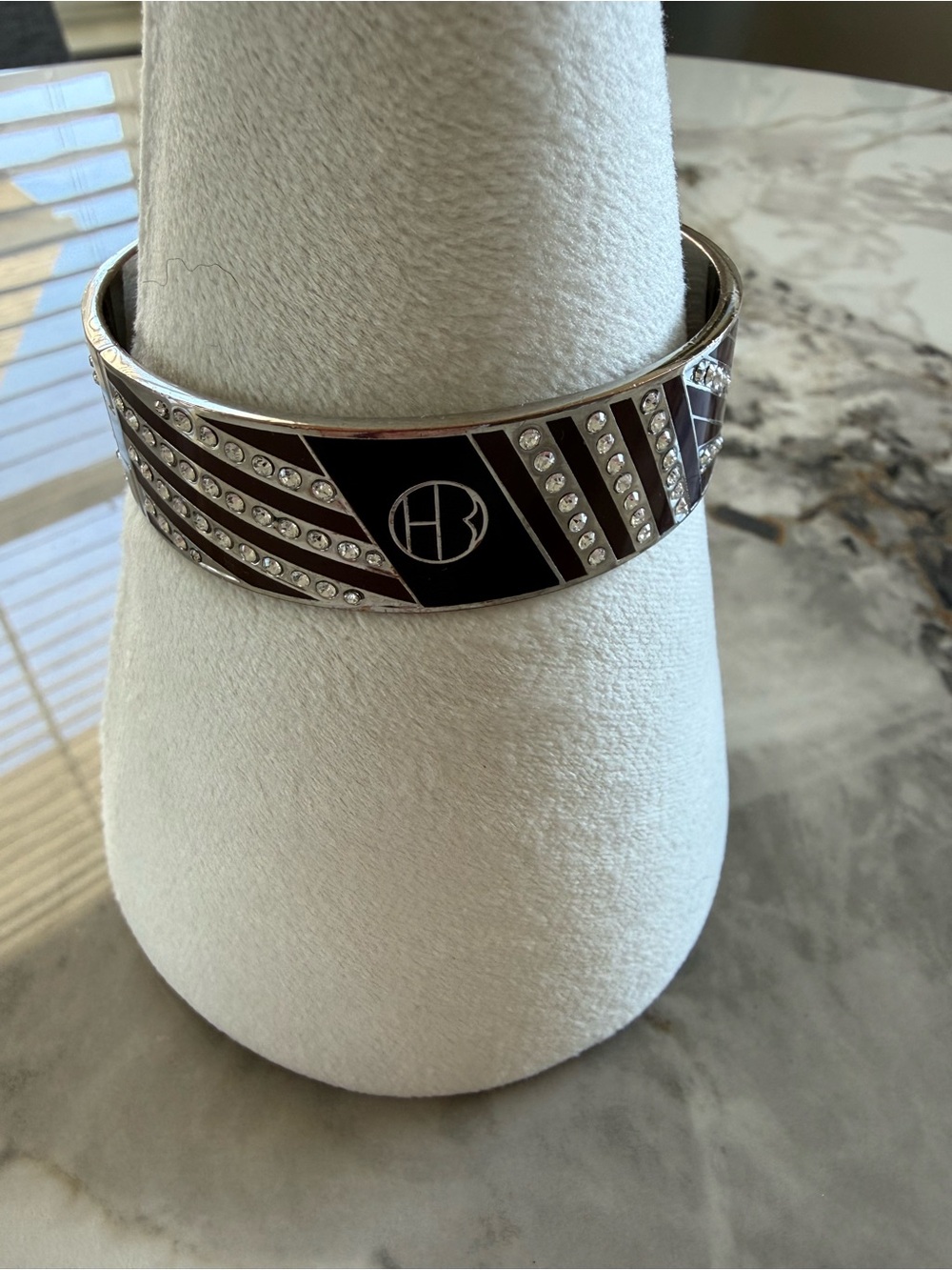Silver-Tone Black Enamel Crystal Logo Bangle
HENRI BENDEL